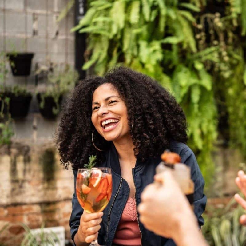 Couple laughing and enjoying a drink